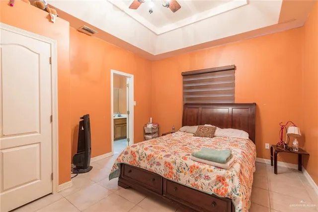 a bedroom with a bed and a table in it