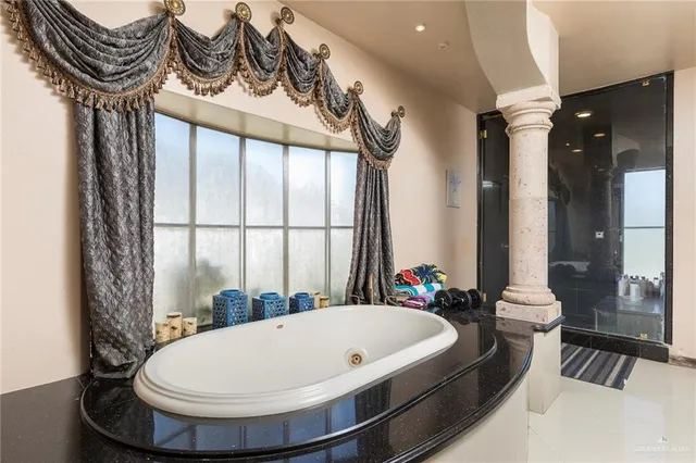 a bathroom with a bathtub and a sink