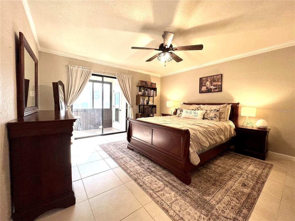 2101 Hammock Pine Boulevard, Unit 2101 Clearwater, FL 33761 - Photo 13 of 24 a bedroom with a large bed and a window