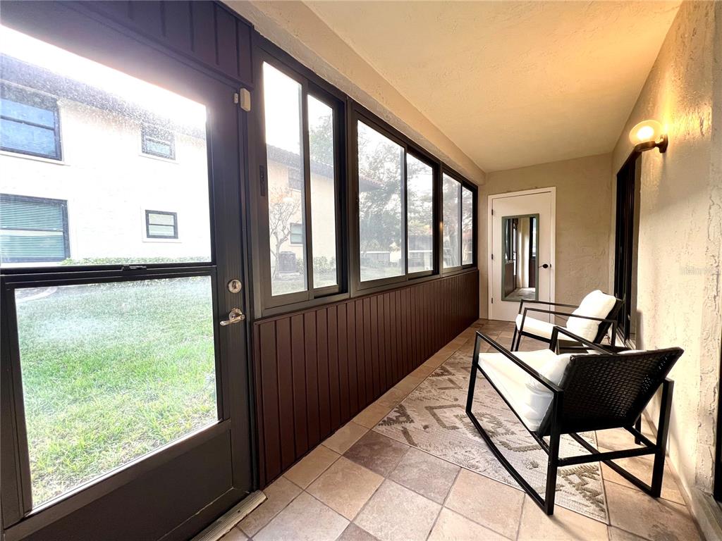 2101 Hammock Pine Boulevard, Unit 2101 Clearwater, FL 33761 - Photo 18 of 24 a living room with furniture and a window