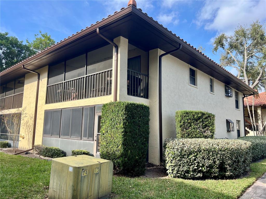 2101 Hammock Pine Boulevard, Unit 2101 Clearwater, FL 33761 - Photo 22 of 24 a front view of a house with garden