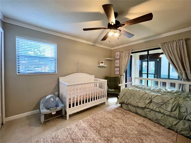 a bedroom with bed and a window