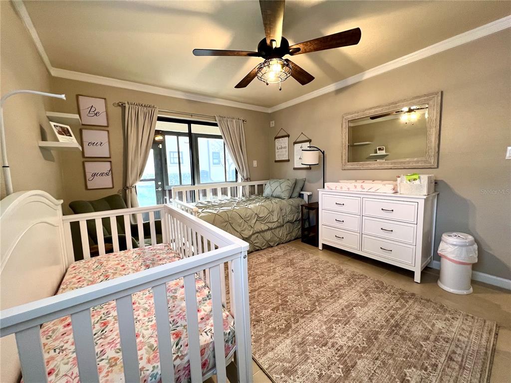 2101 Hammock Pine Boulevard, Unit 2101 Clearwater, FL 33761 - Photo 10 of 24 a bedroom with furniture and window