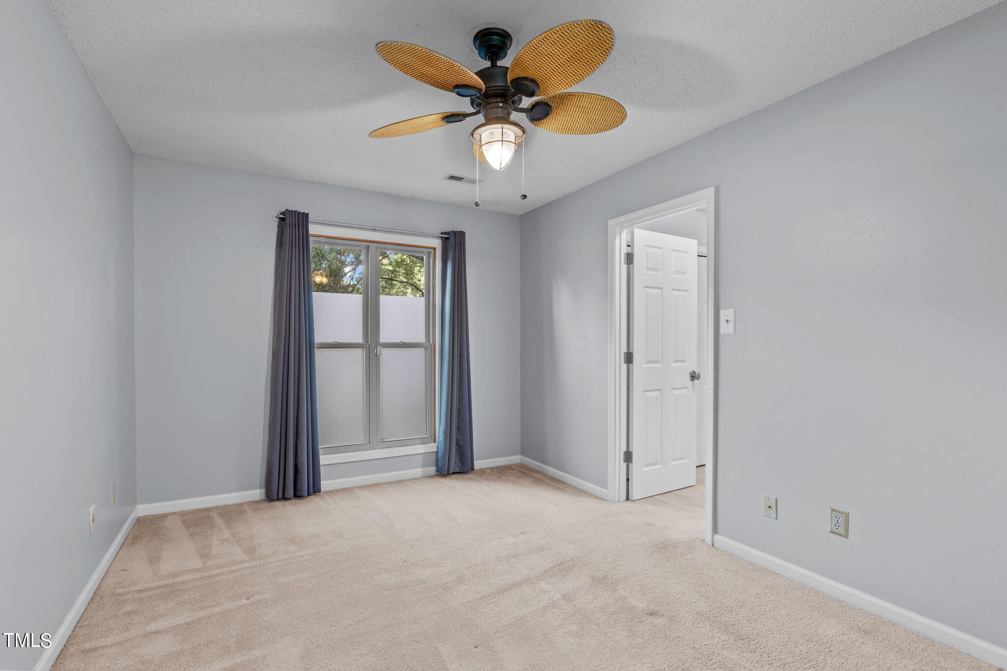 240 Clancy Circle Cary, NC 27511 - Photo 18 of 27 a view of an empty room with a window