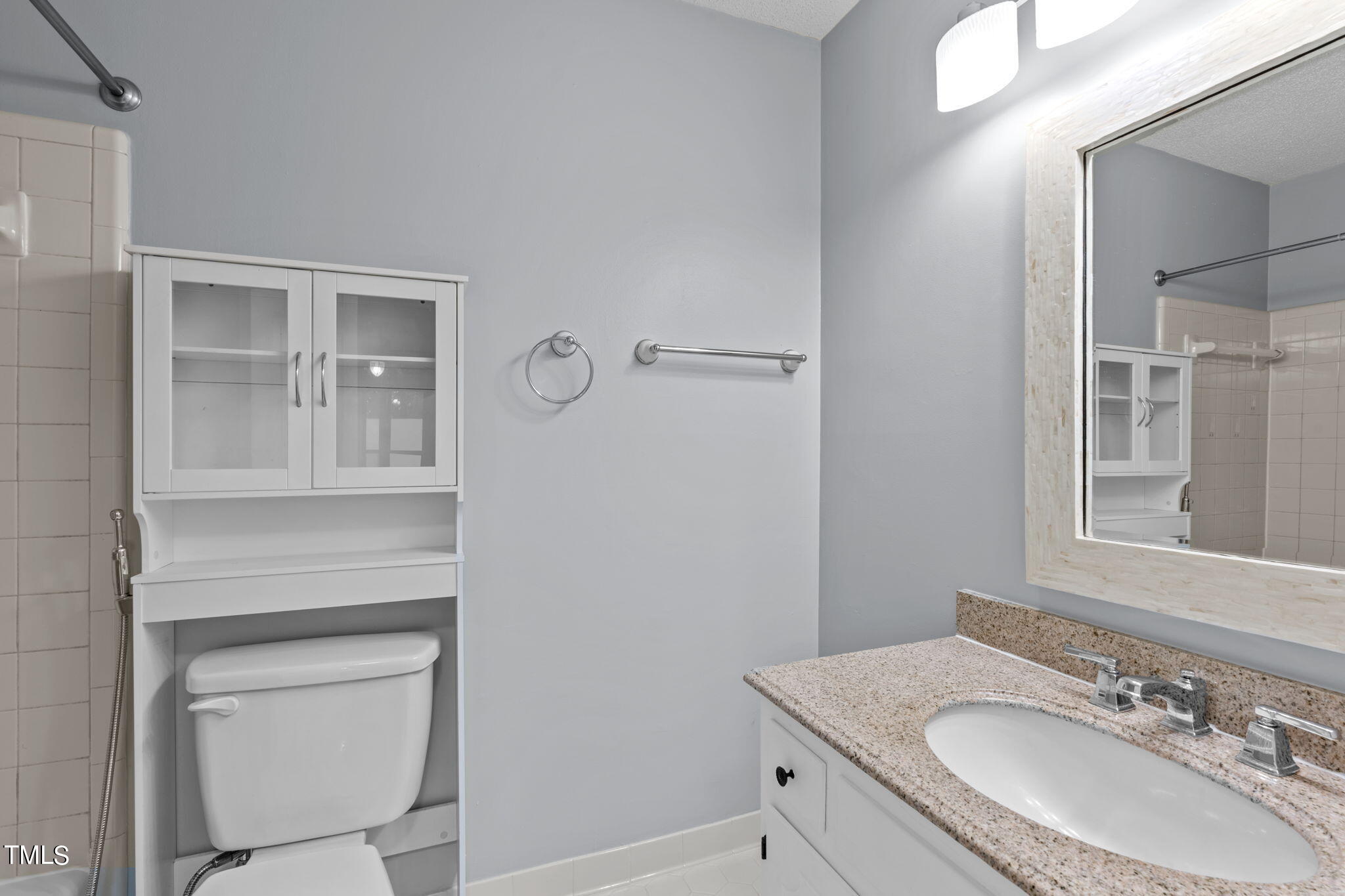 240 Clancy Circle Cary, NC 27511 - Photo 19 of 27 a bathroom with a sink vanity and a mirror