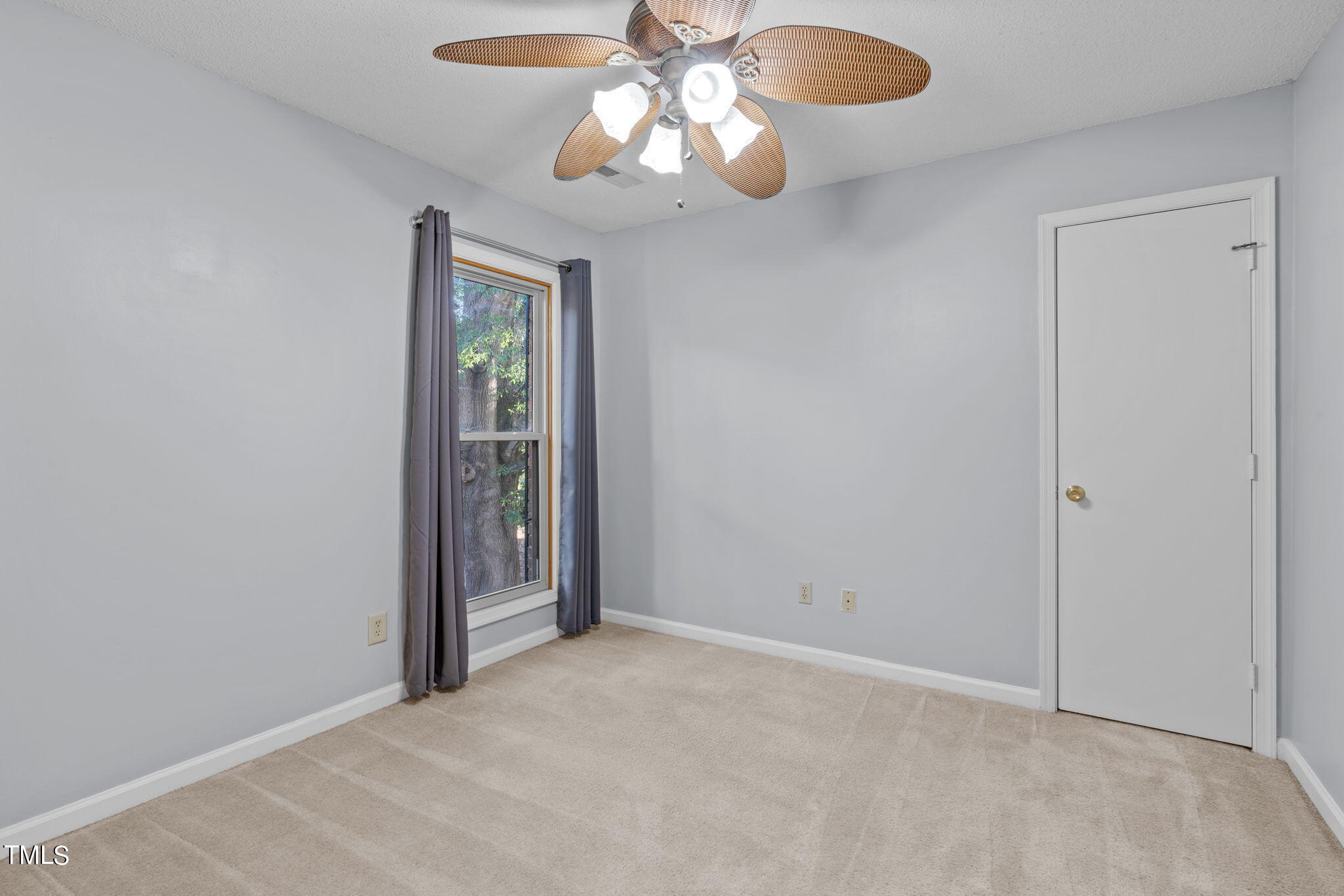 240 Clancy Circle Cary, NC 27511 - Photo 20 of 27 a view of an empty room with a chandelier fan