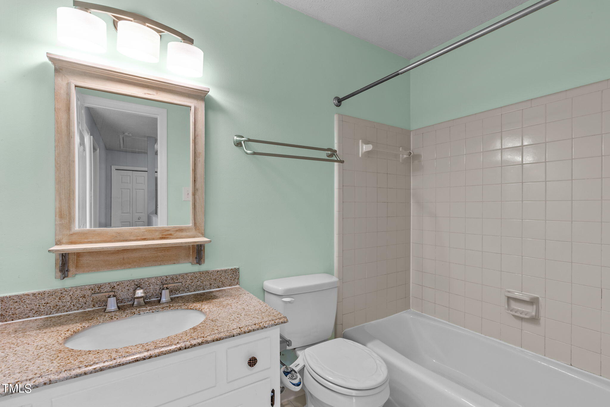 240 Clancy Circle Cary, NC 27511 - Photo 21 of 27 a bathroom with a granite countertop sink toilet and shower