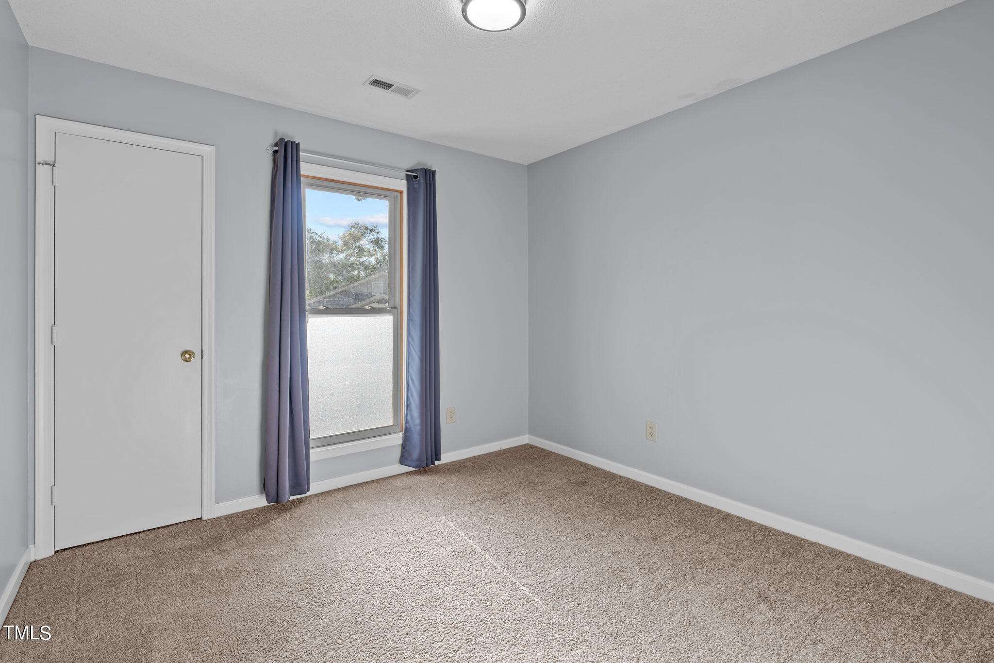240 Clancy Circle Cary, NC 27511 - Photo 22 of 27 an empty room with windows