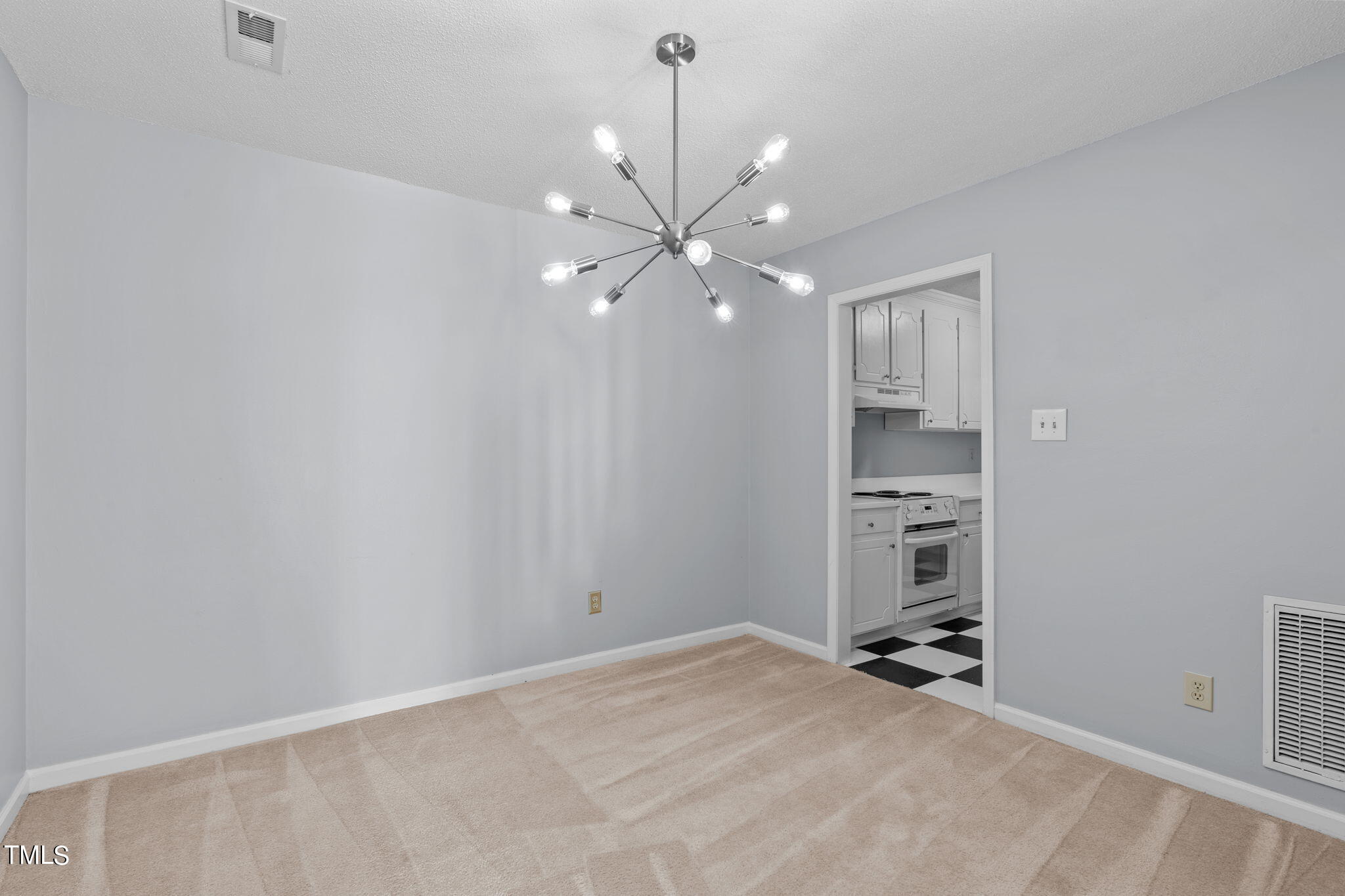 240 Clancy Circle Cary, NC 27511 - Photo 10 of 27 an empty room with a ceiling fan and a window