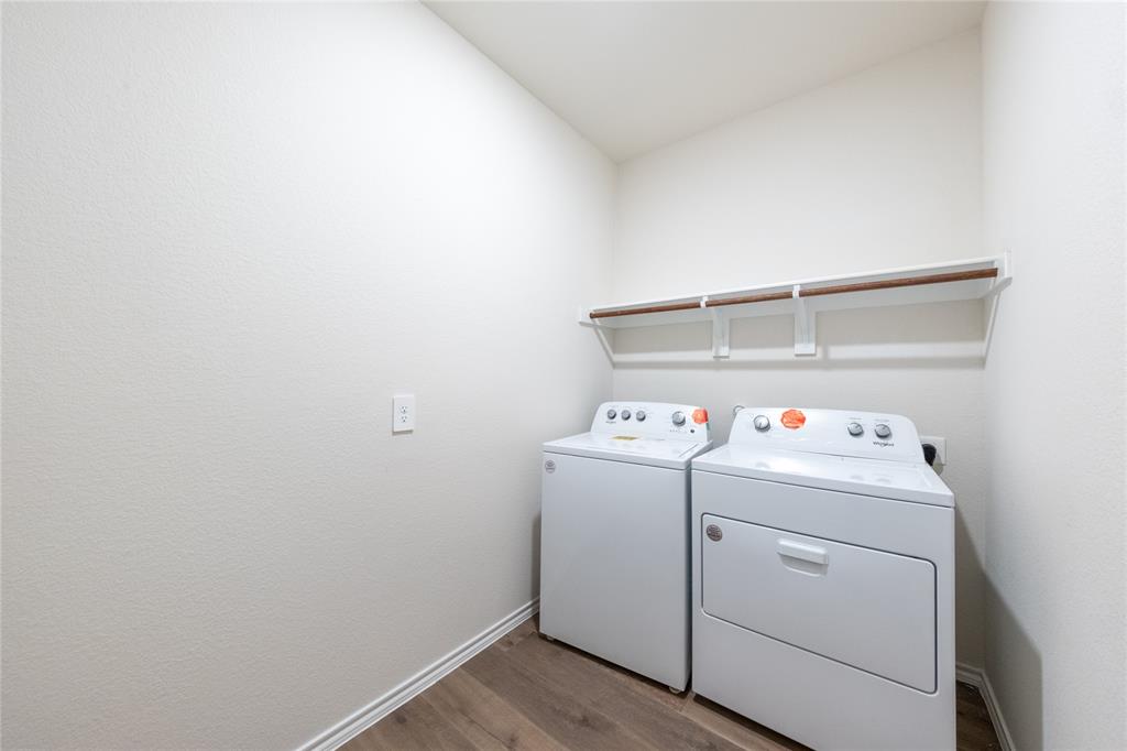 13156 Dawson Drive Providence Village, TX 76227 - Photo 12 of 31 a utility room with dryer and washer