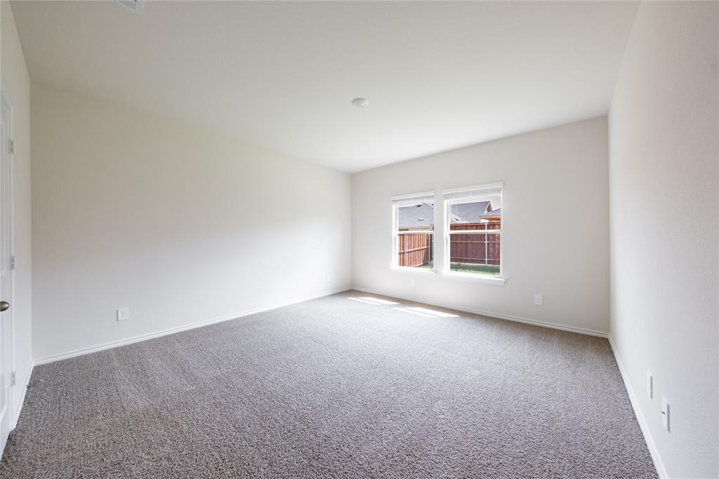 13156 Dawson Drive Providence Village, TX 76227 - Photo 17 of 31 a view of an empty room with a window