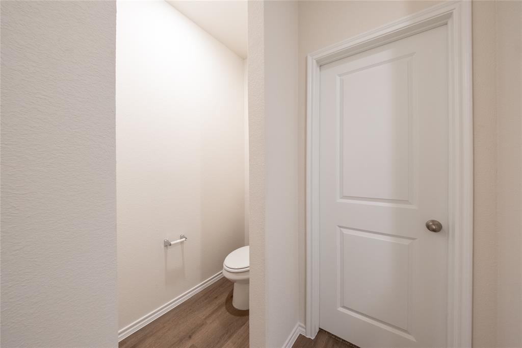 13156 Dawson Drive Providence Village, TX 76227 - Photo 21 of 31 a white toilet sitting next to a shower