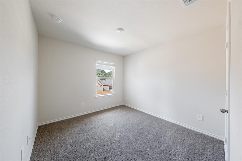 13156 Dawson Drive Providence Village, TX 76227 - Photo 26 of 31 an empty room with windows