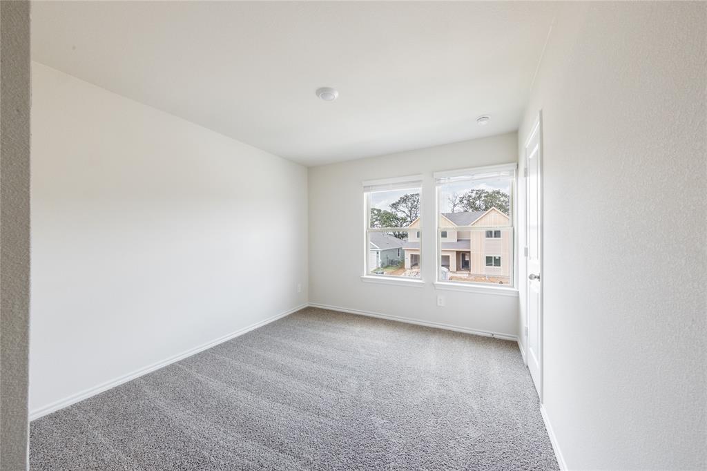 13156 Dawson Drive Providence Village, TX 76227 - Photo 28 of 31 a view of an empty room with a window