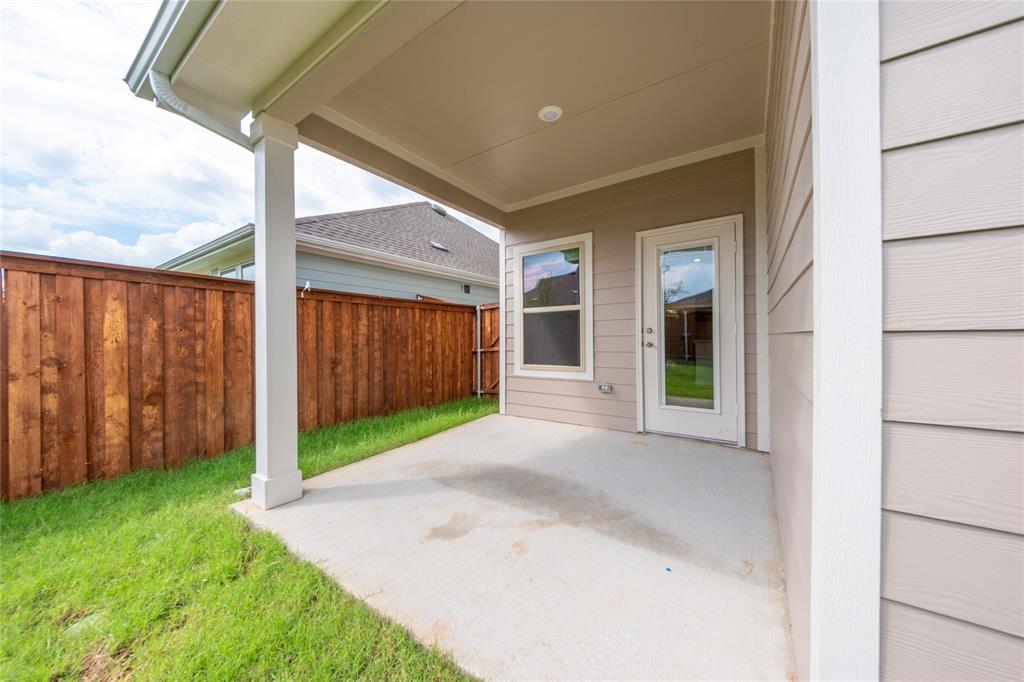 13156 Dawson Drive Providence Village, TX 76227 - Photo 31 of 31 a view of a backyard with garden