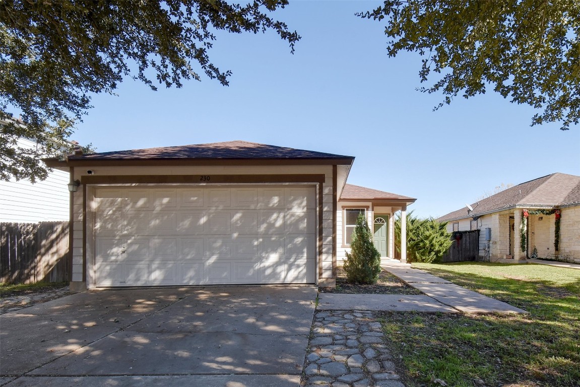 230 Beech Drive Kyle, TX 78640 - Photo 1 of 1 a front view of a house with garden