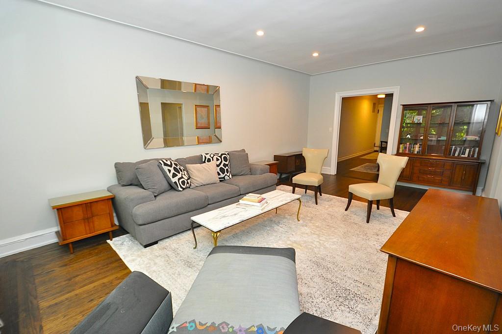 143 Garth Road, Unit 4P Scarsdale, NY 10583 - Photo 4 of 44 Bright and Sunny living room overlooks Garth Woods and has recessed lighting and hardwood floors.
