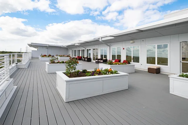 a view of a living room and a balcony