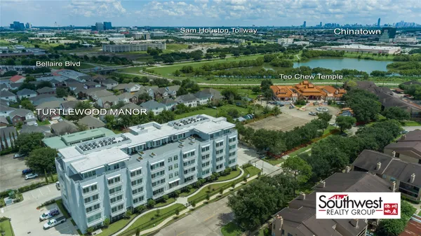 an aerial view of a house with a lake view