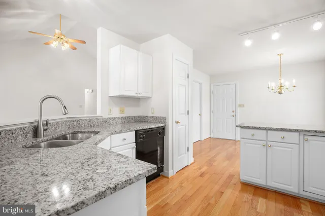 a kitchen with sink refrigerator and stove