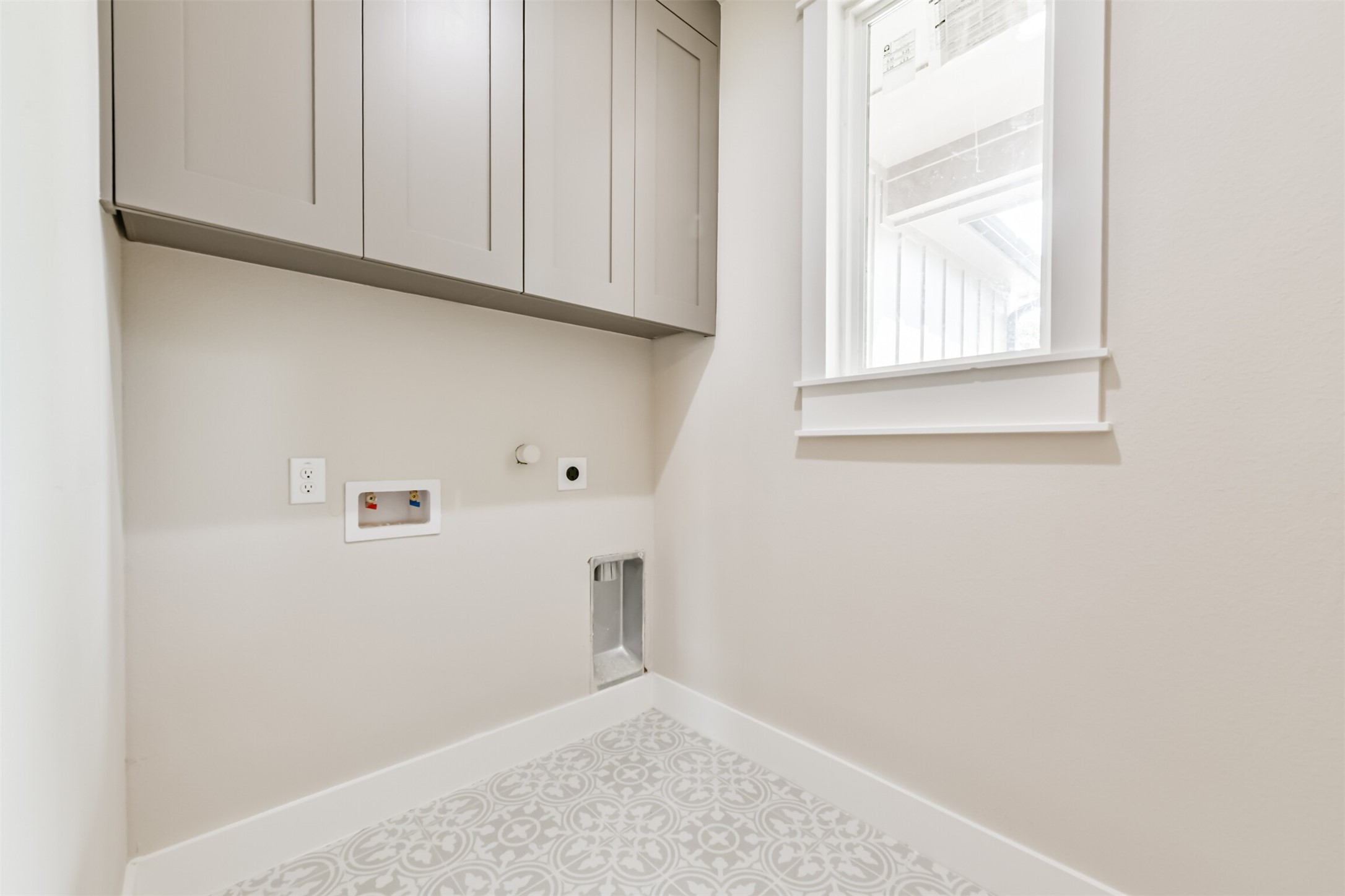250 Pony Trail Angleton, TX 77515 - Photo 5 of 32 Efficient laundry room featuring ample storage cabinets.