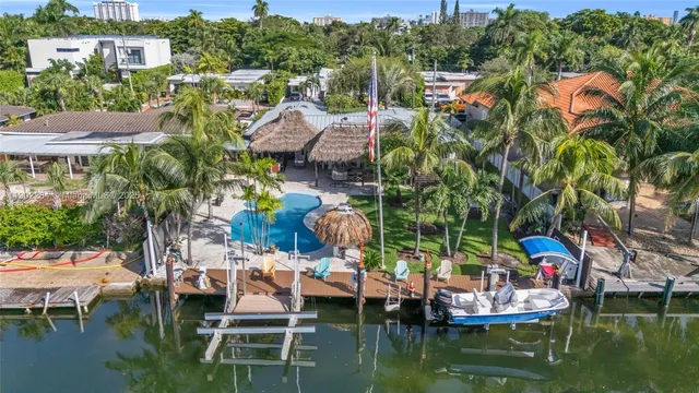 a small pool with couple of relaxing chair