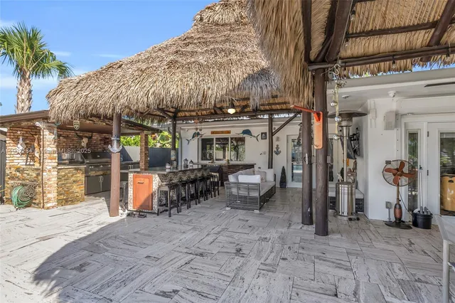 an aerial view of multiple houses with yard