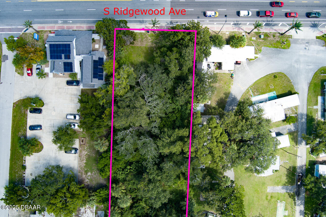 0 South Ridgewood Avenue South Daytona, FL 32119 - Photo 3 of 9 a aerial view of a house with a yard and garden