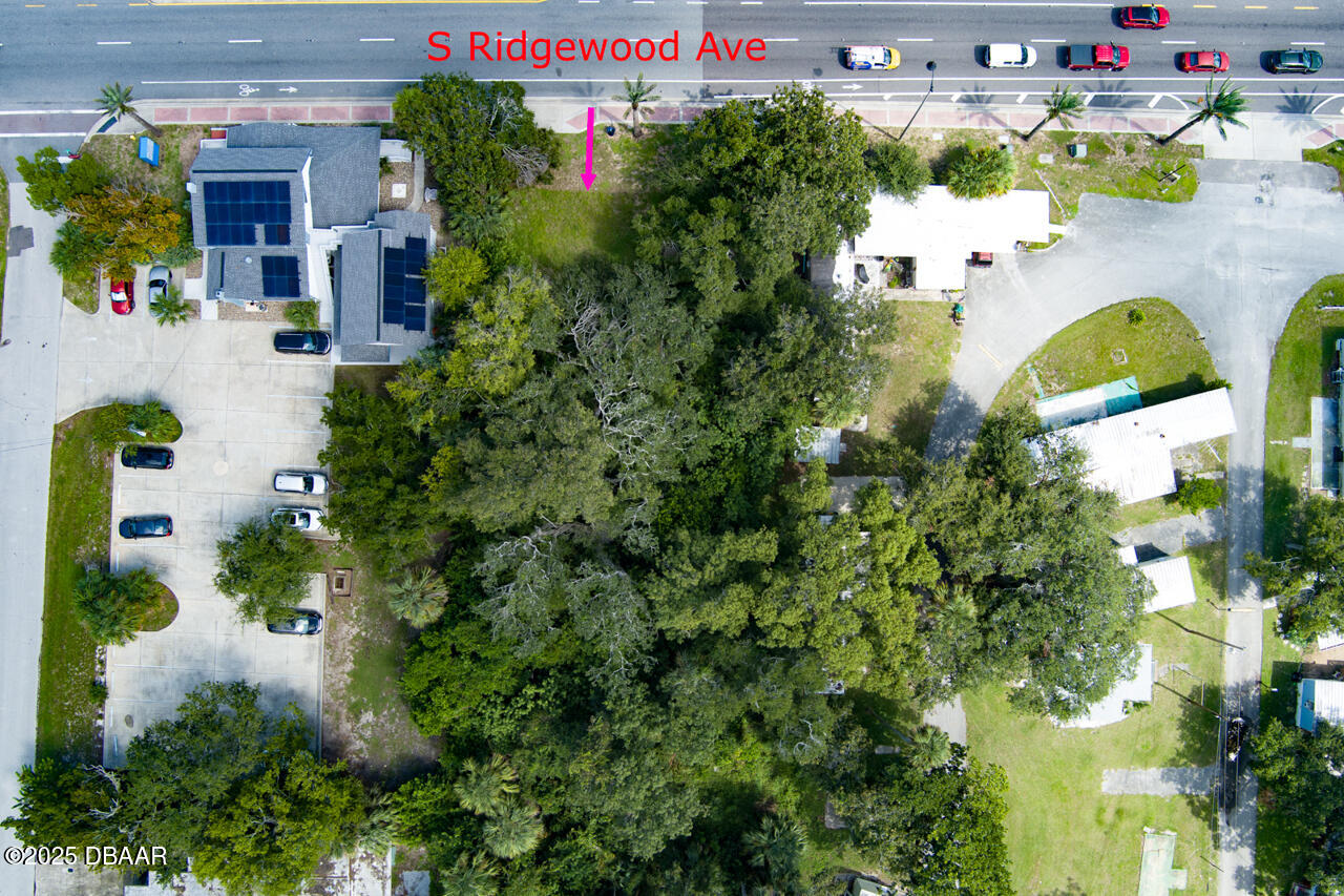 0 South Ridgewood Avenue South Daytona, FL 32119 - Photo 4 of 9 a aerial view of a house with a yard and fountain