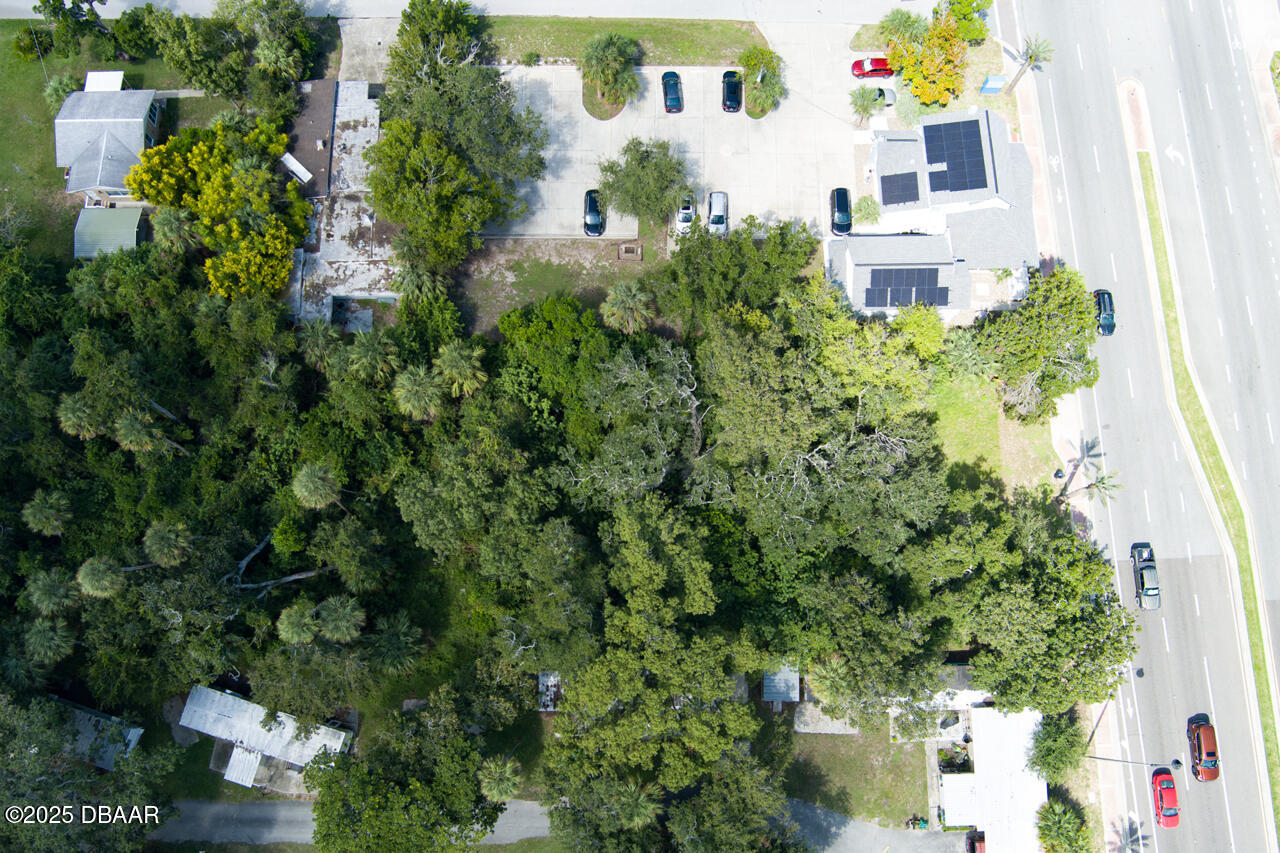 0 South Ridgewood Avenue South Daytona, FL 32119 - Photo 7 of 9 an aerial view of a house with a yard and garden
