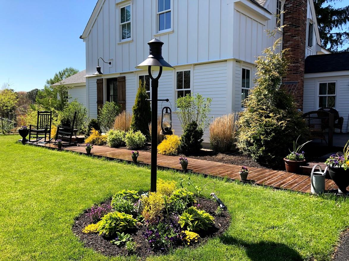 640 Setucket Road East Dennis, MA 02660 - Photo 2 of 57 a front view of a house with garden