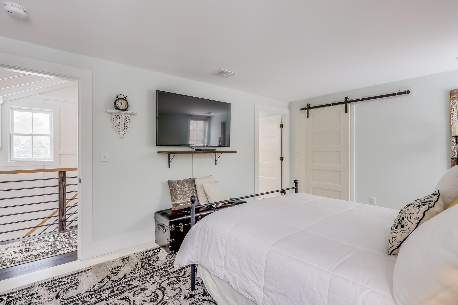 640 Setucket Road East Dennis, MA 02660 - Photo 40 of 57 a bedroom with a bed and a flat screen tv