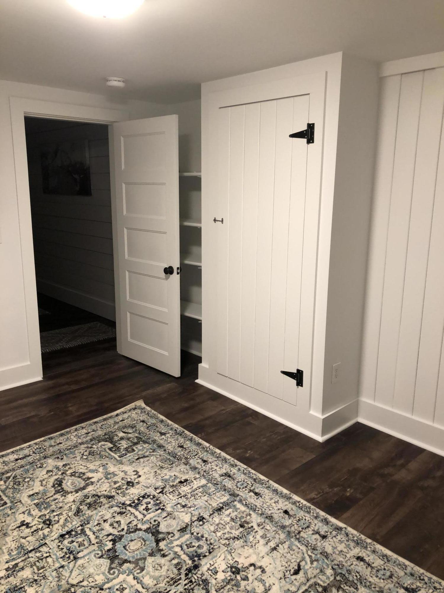 640 Setucket Road East Dennis, MA 02660 - Photo 51 of 57 a view of a bedroom with wooden floor and white walls