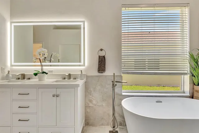 a bathroom with a bathtub and a shower