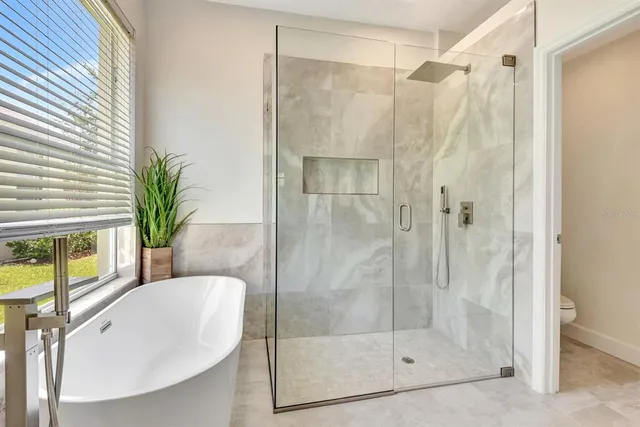 a view of a workspace with furniture and a potted plant