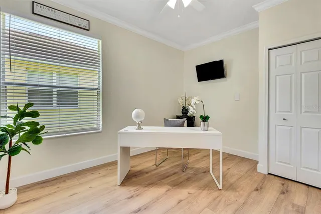 a view of entryway and hall with wooden floor