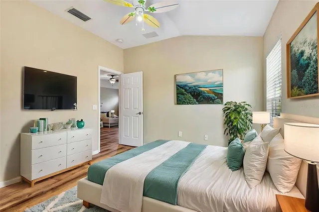 a bathroom with a granite countertop sink toilet and a mirror