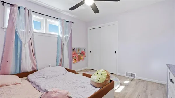 a bedroom with a bed and a dresser