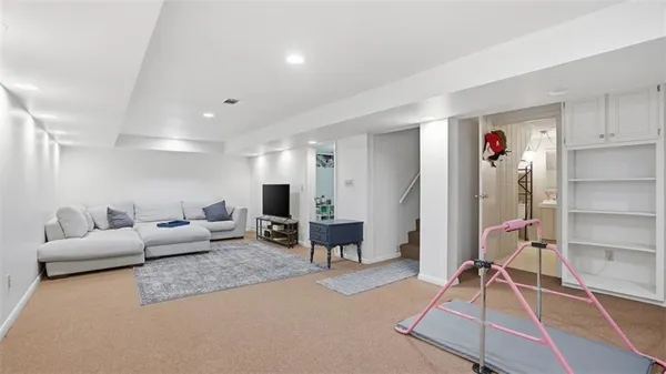 a living room with furniture and a table