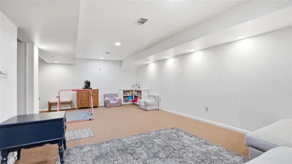 a bedroom with furniture and a window