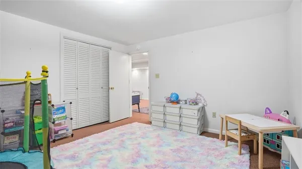 a bathroom with a shower and a sink