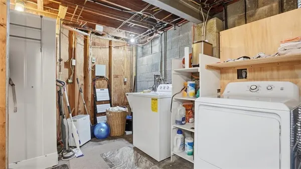 a view of a livingroom with furniture and a window