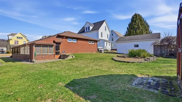 a view of a garden with a building in the background
