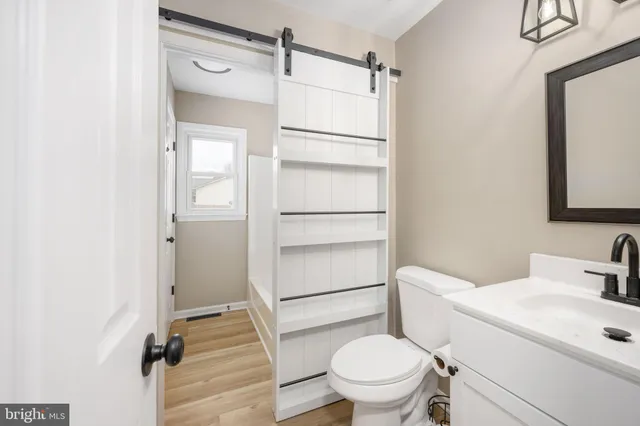 a bathroom with a toilet and a sink