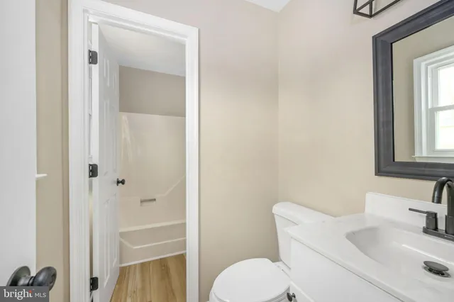 a bathroom with a sink toilet and tub