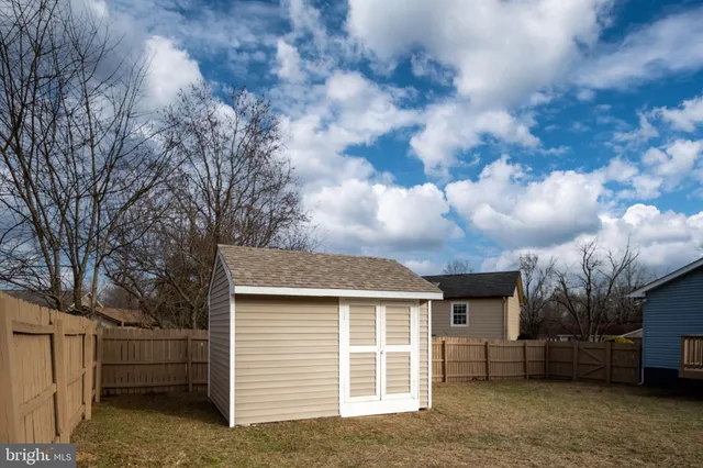 a view of a house with a back yard