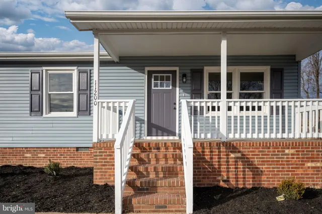 a front view of a house with a garage