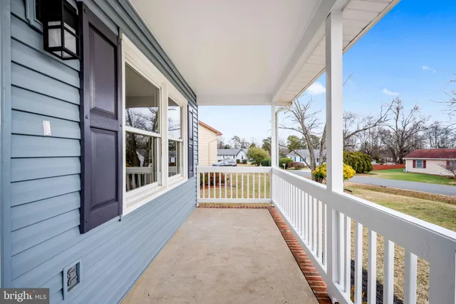 a view of a house with a small yard