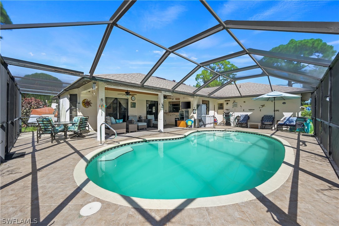 17413 Butler Road Fort Myers, FL 33967 - Photo 1 of 33 a view of a swimming pool with a patio