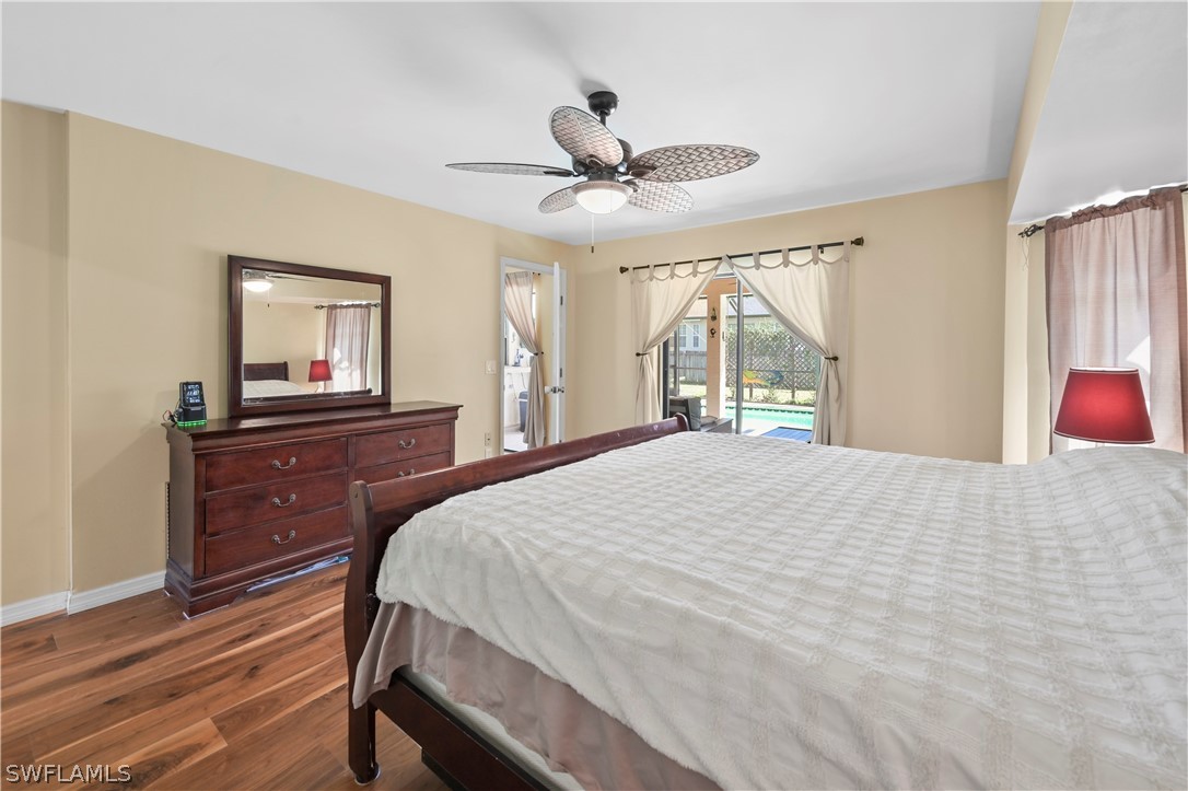 17413 Butler Road Fort Myers, FL 33967 - Photo 13 of 33 a bedroom with a bed and a dresser